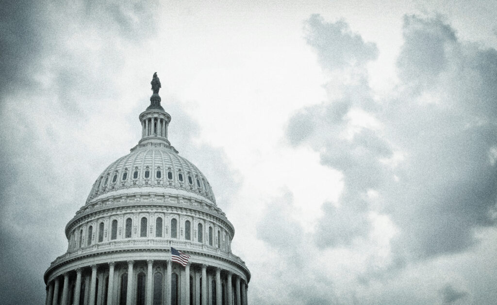 A textured image of the United States Capitol dome on a cloudy day.