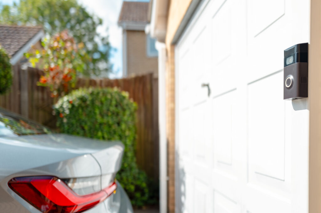 A doorbell camera on a garage door.
